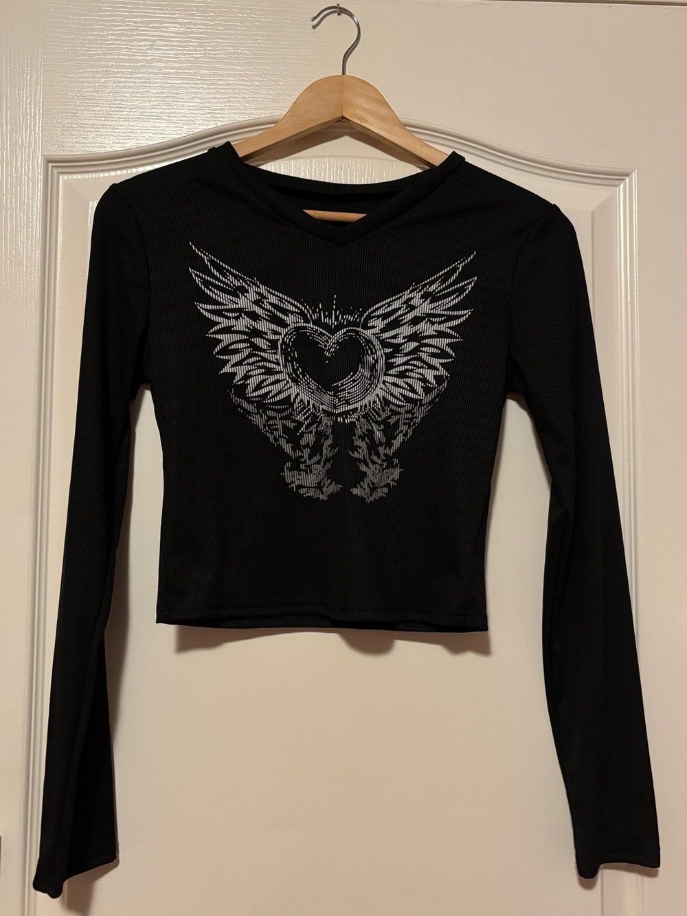 Black Long-Sleeve Graphic Crop Top - Winged Heart Design